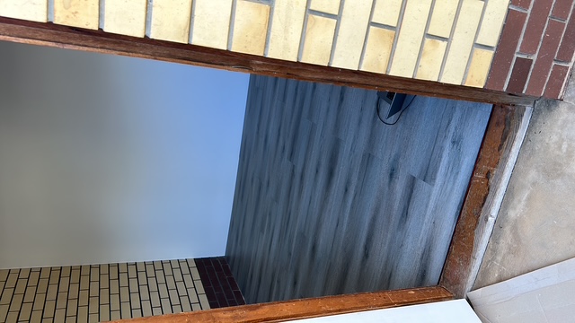 Same room with new grey plank flooring