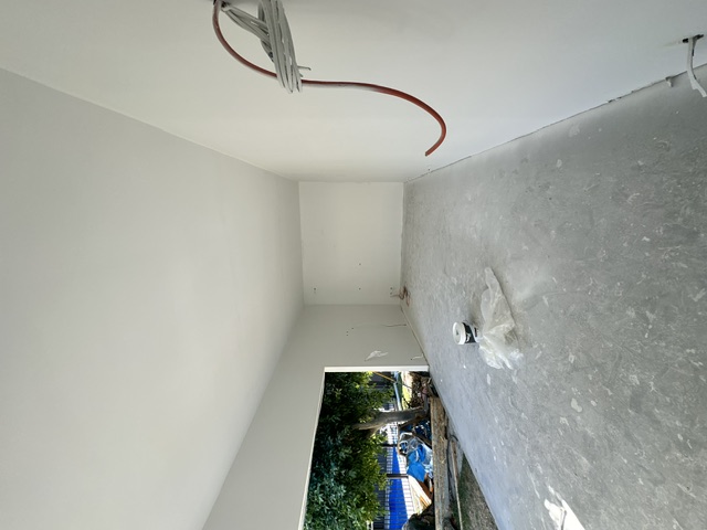 Garden room with bare concrete floor